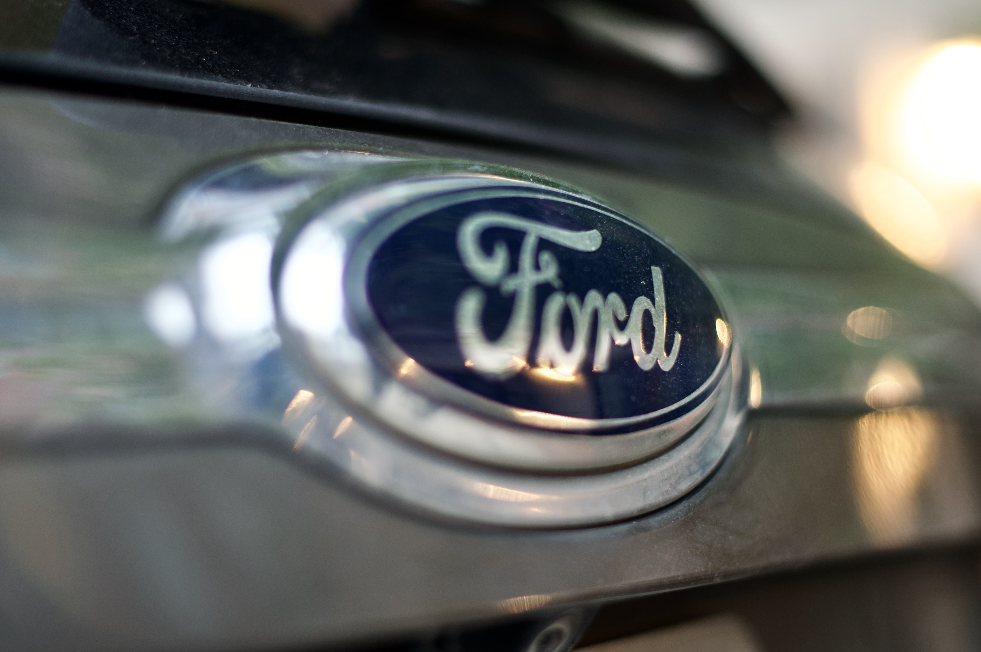 Close-up of a Ford vehicle emblem representing the Sync 3 investigation